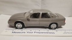 NIB Ertl 1/24 scale 1989 Ford Taurus SHO ( Titanium Met ) promo model #6054