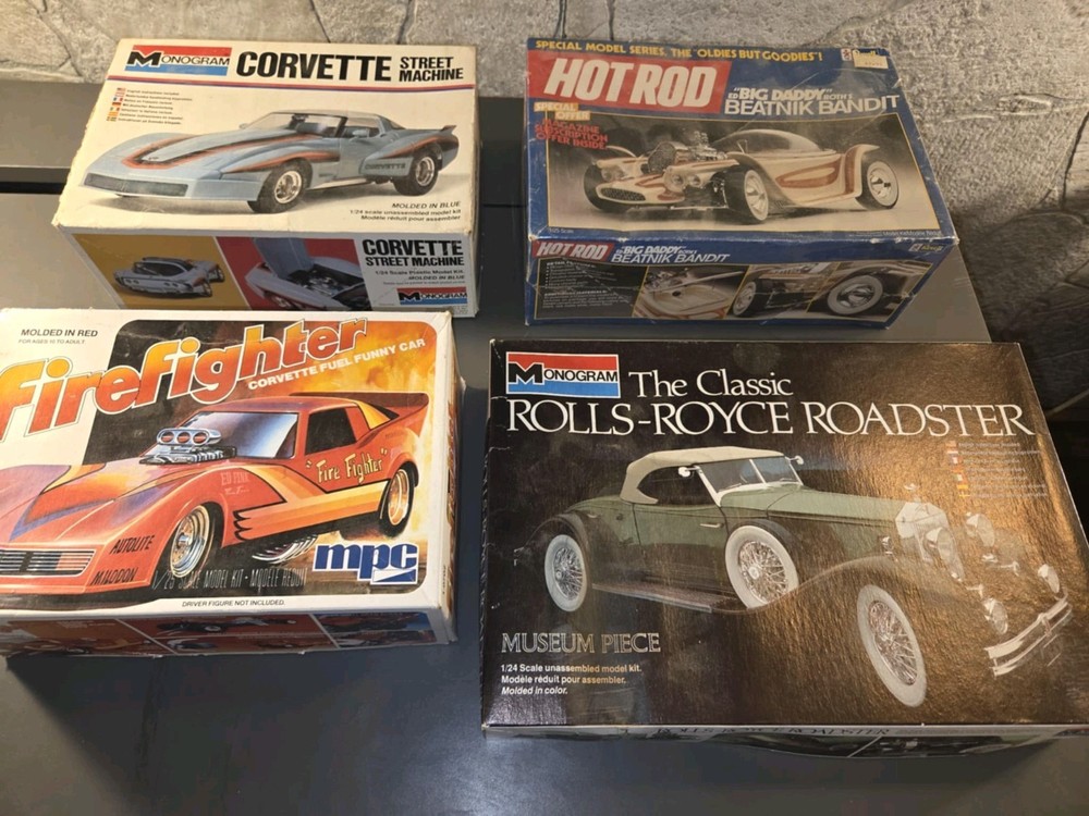 Set of 4 Model Cars – some are partially assembled