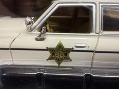 Greenlight 84094 1/24 1975 Dodge Monaco Cream “Hazzard County Sheriff”