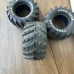 vintage 1 1/10 scale monster truck tires featuring prominent Goodyear lettering