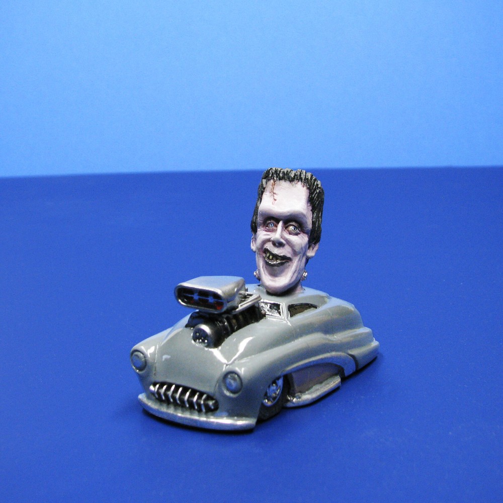 Jimmy Flintstone resin Lil Shitzz Happy Herman Munster aboard a ’49 Merc LS5