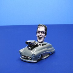Jimmy Flintstone resin Lil Shitzz Happy Herman Munster aboard a ’49 Merc LS5