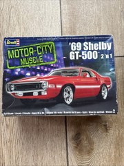 two 1:25 scale plastic model kits- ‘49 Mercury and ‘69 Shelby GT-500