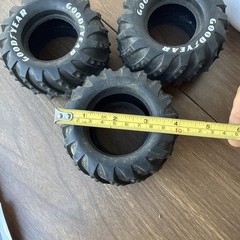 vintage 1 1/10 scale monster truck tires featuring prominent Goodyear lettering