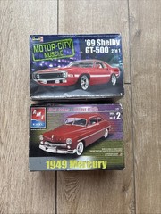 two 1:25 scale plastic model kits- ‘49 Mercury and ‘69 Shelby GT-500